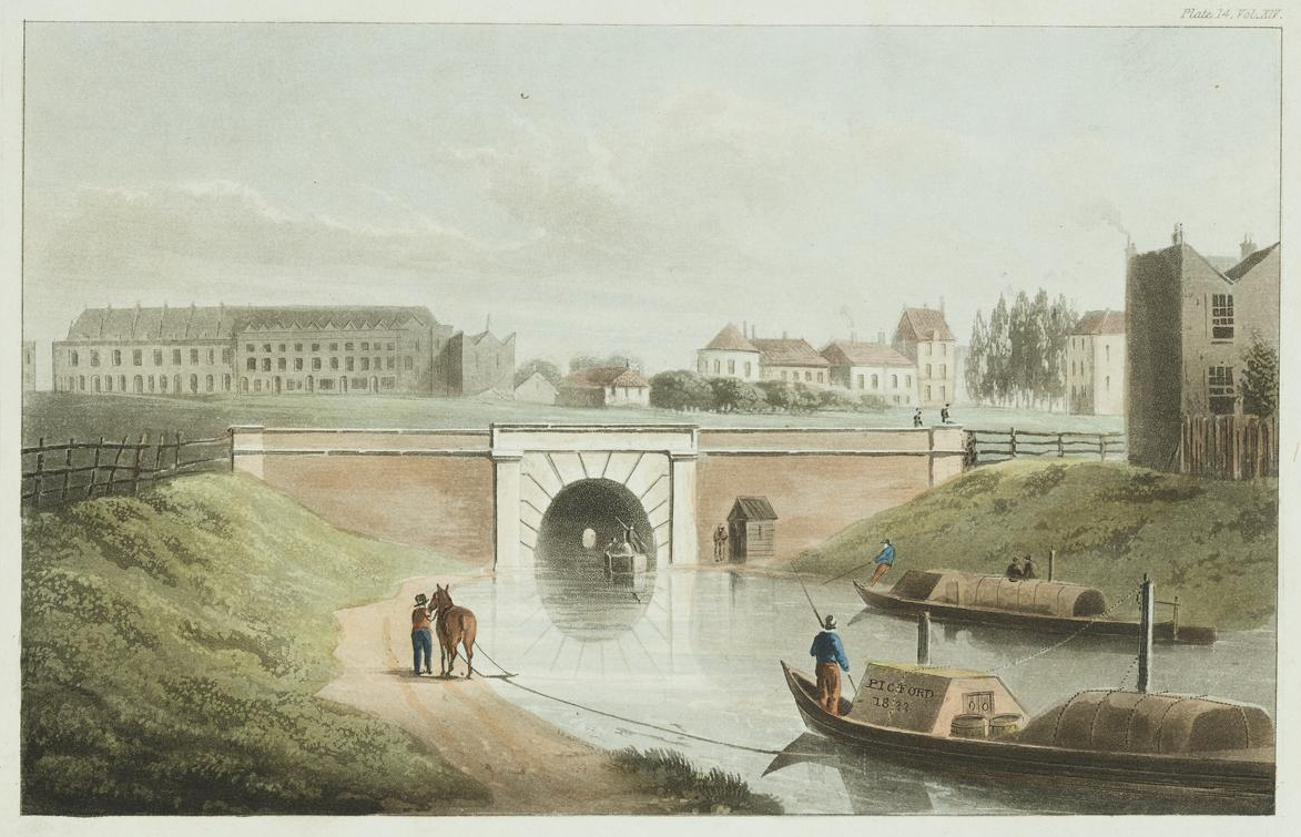 Two boats on a canal, one being pulled by a horse